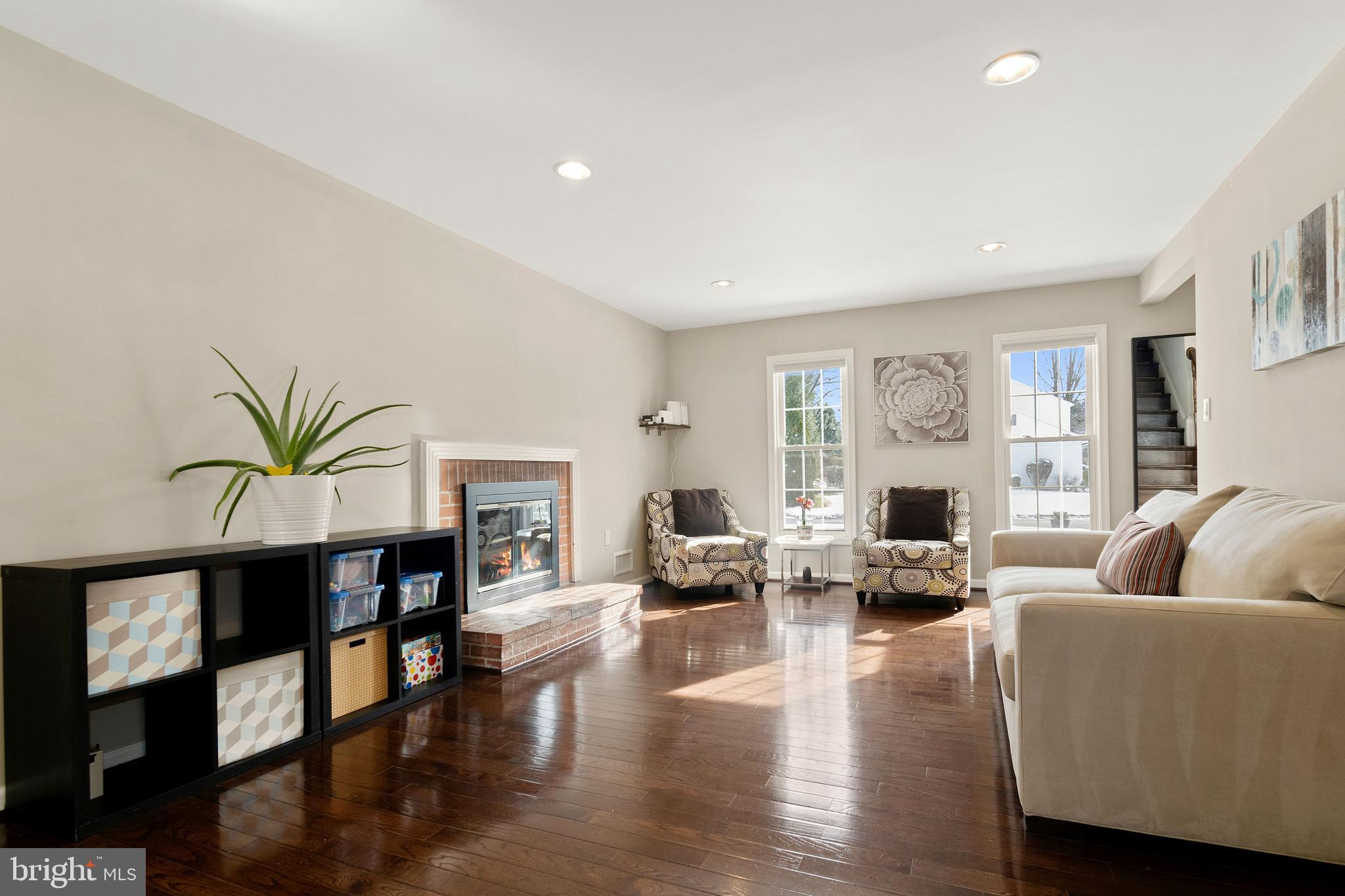 11600 Coldstream Drive Potomac, MD 20854 - Photo 12 of 25 a living room with furniture or couch and a fireplace