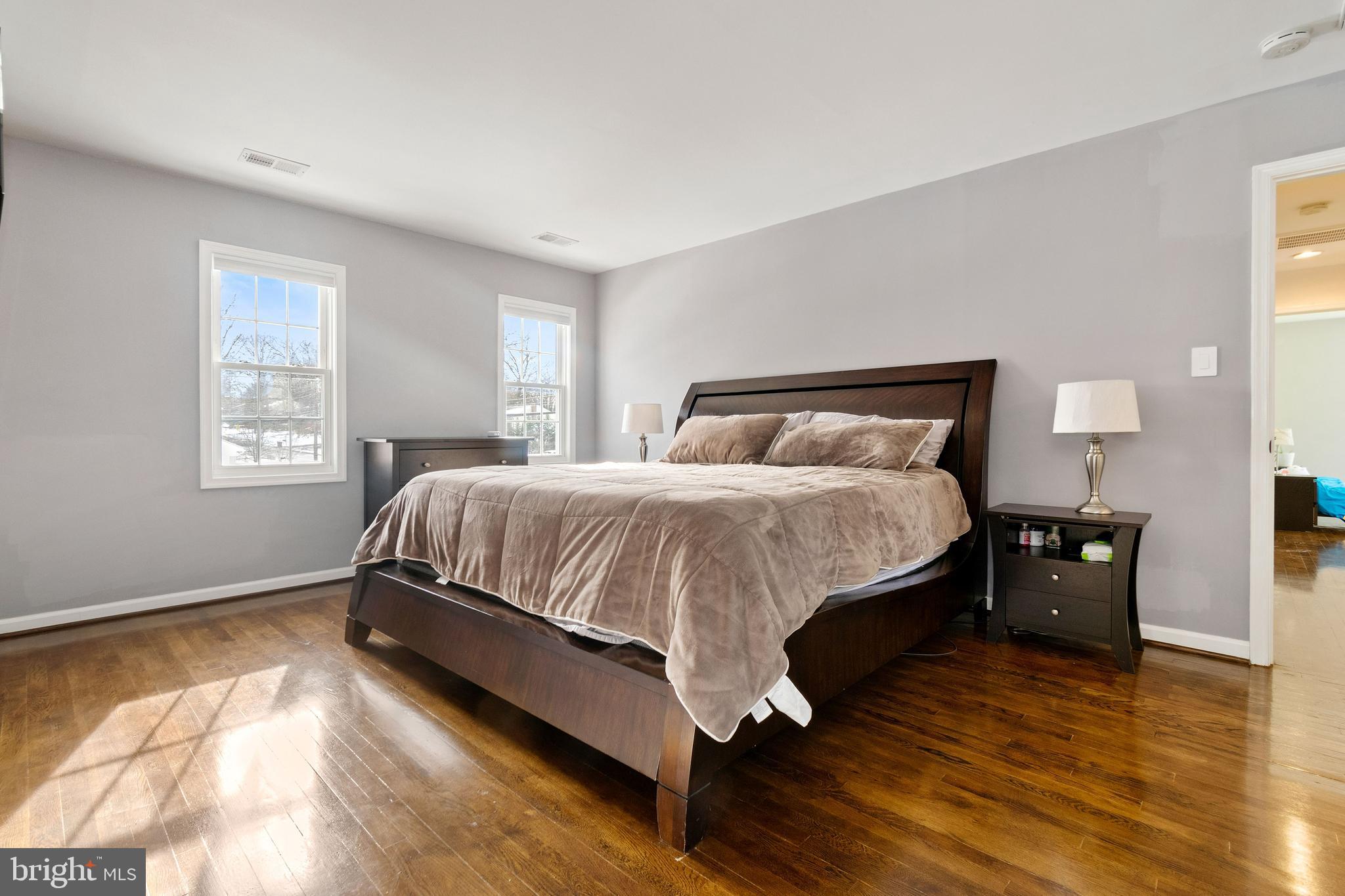 11600 Coldstream Drive Potomac, MD 20854 - Photo 18 of 25 a bedroom with a bed and wooden floor