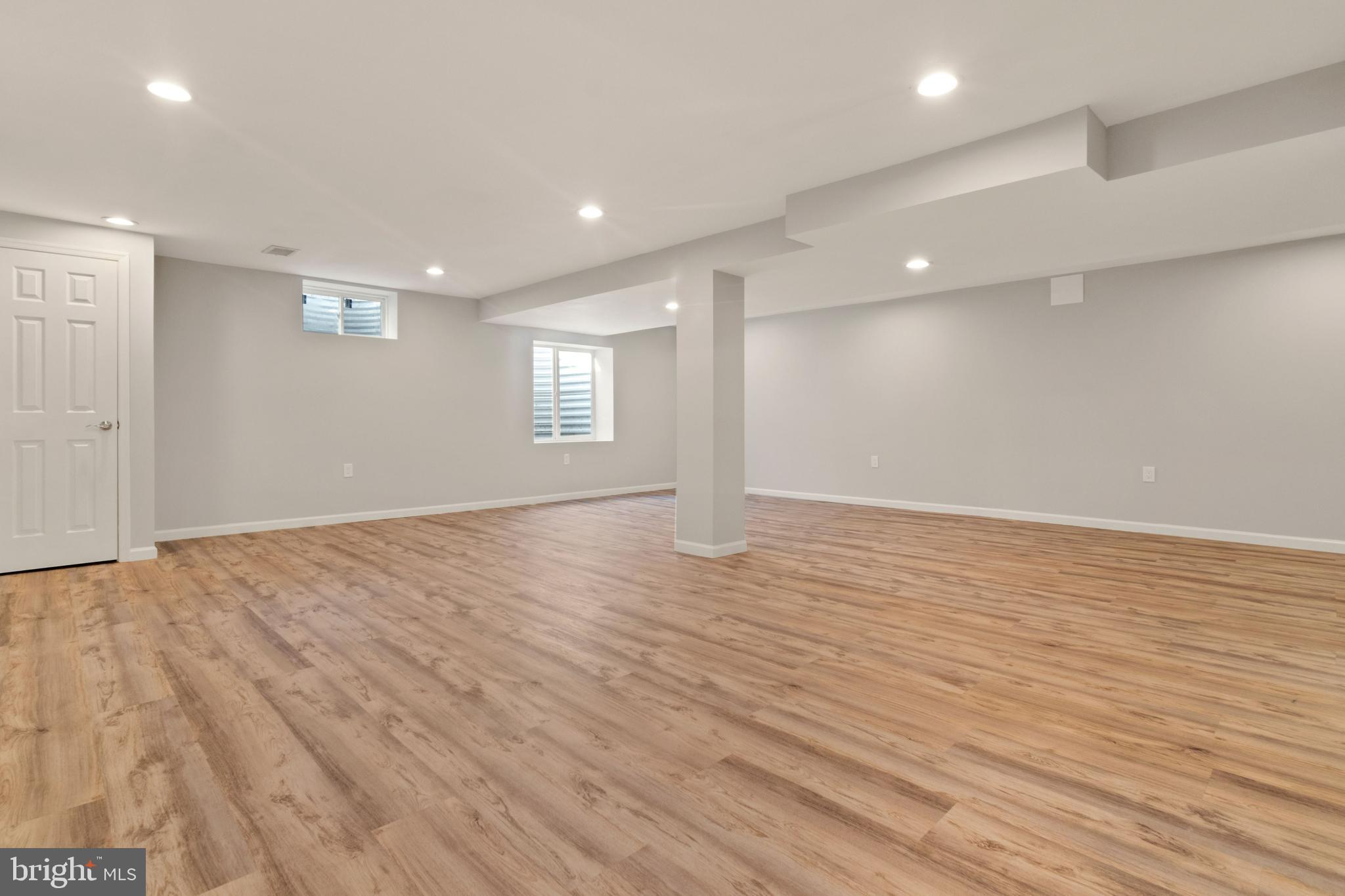 11600 Coldstream Drive Potomac, MD 20854 - Photo 23 of 25 an empty room with wooden floor and windows