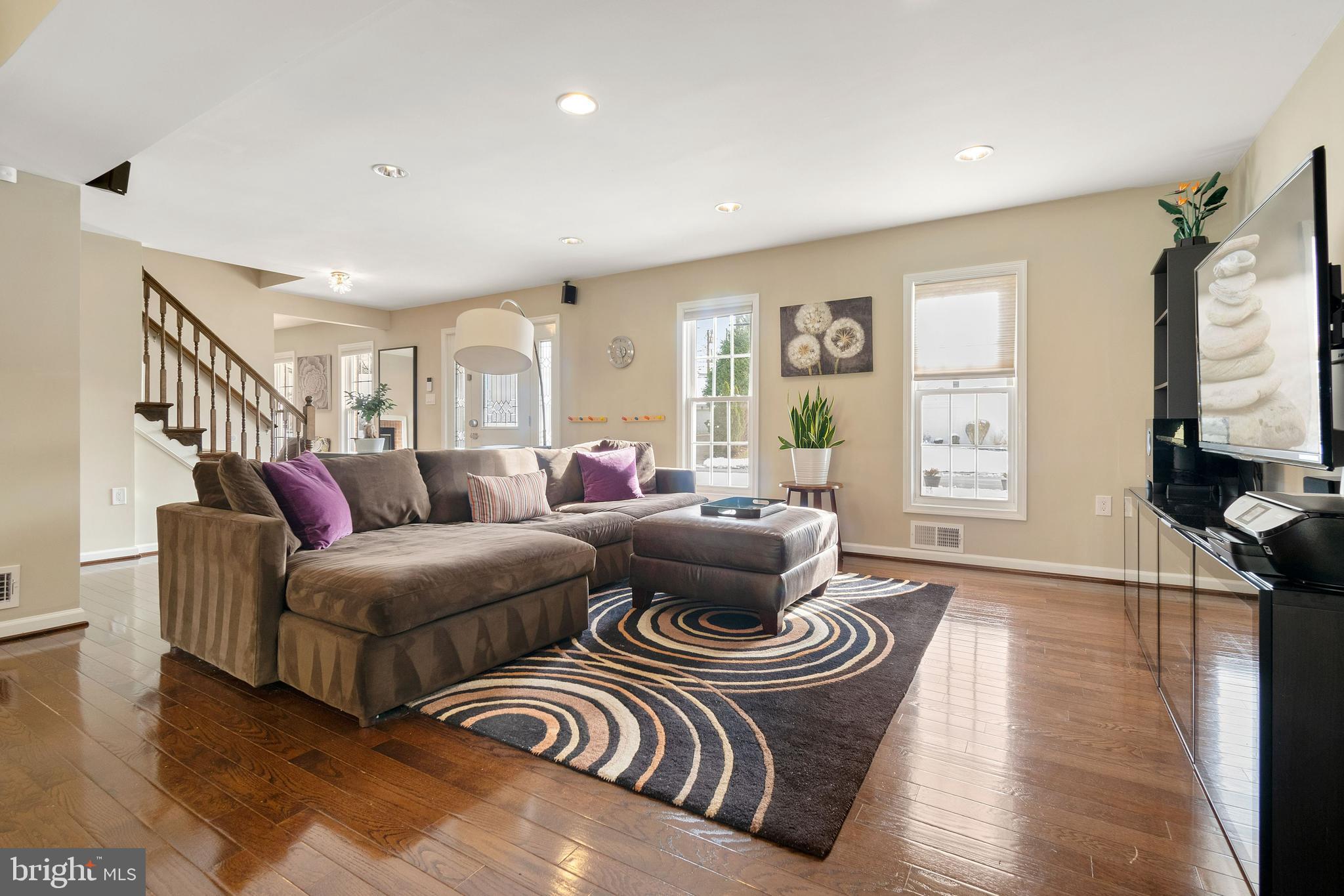 11600 Coldstream Drive Potomac, MD 20854 - Photo 5 of 25 a living room with furniture a rug and a flat screen tv