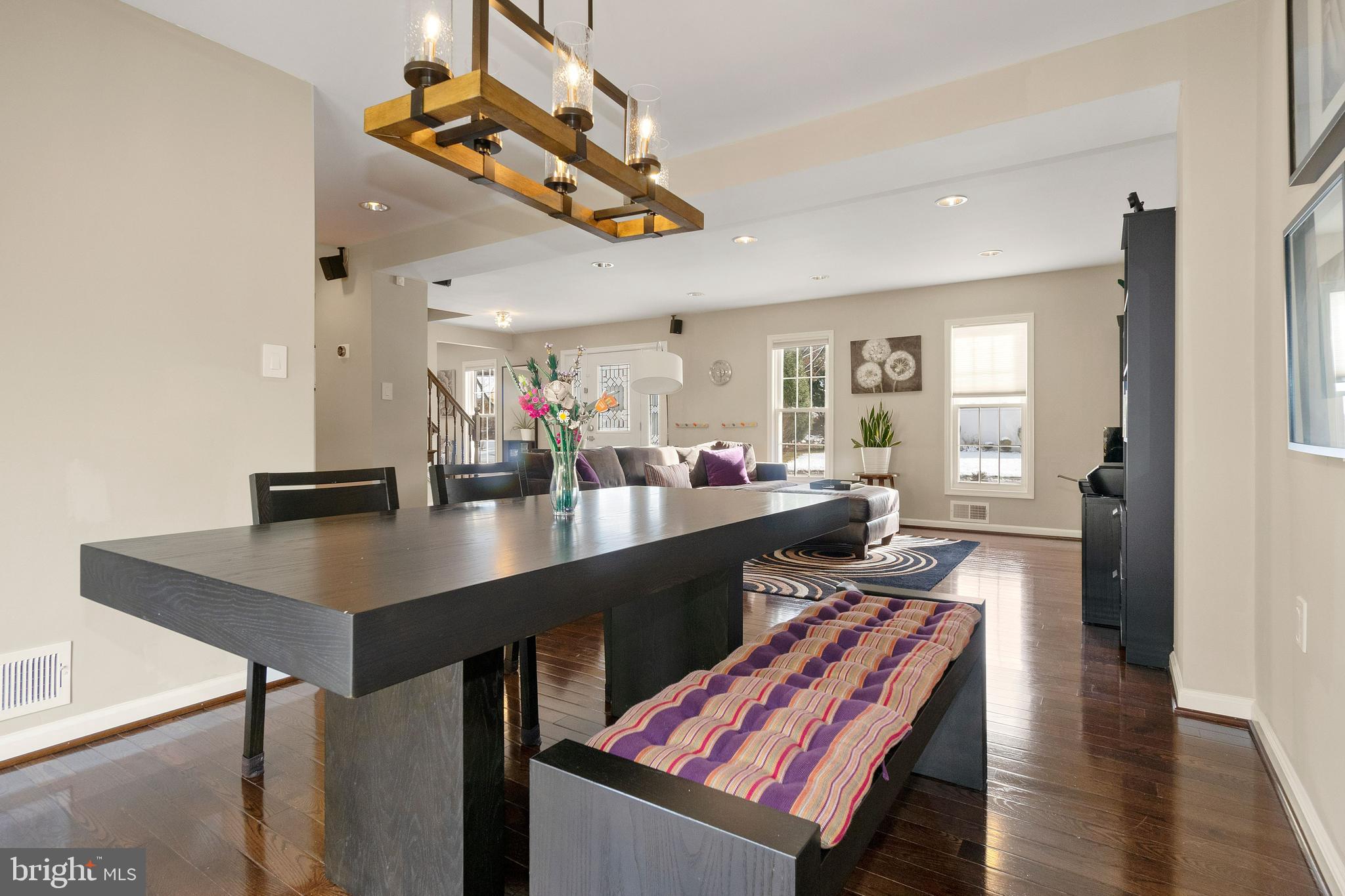 11600 Coldstream Drive Potomac, MD 20854 - Photo 8 of 25 a kitchen with a table chairs stove and wooden floor