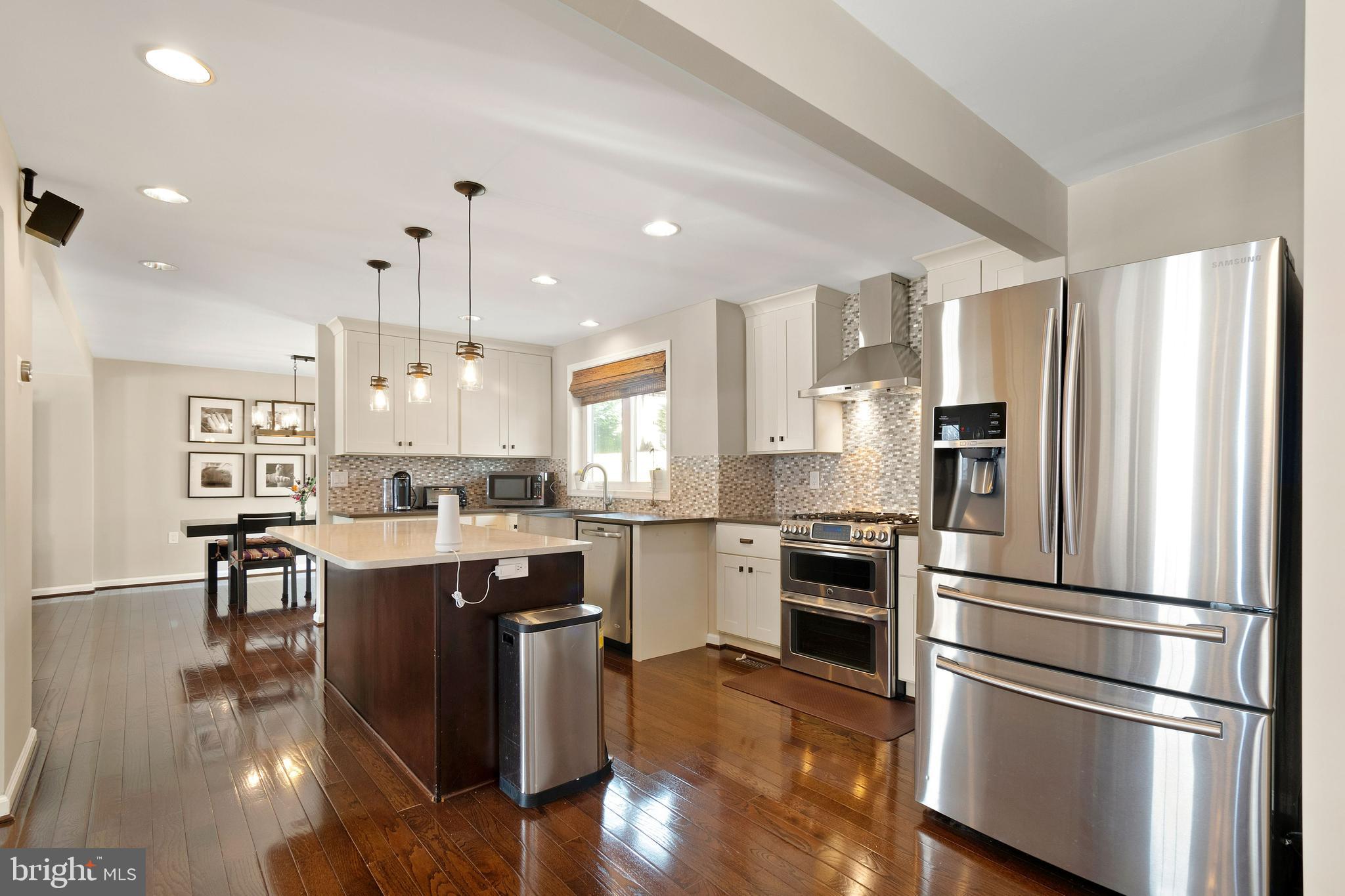 11600 Coldstream Drive Potomac, MD 20854 - Photo 9 of 25 a kitchen with a refrigerator a sink dishwasher and a stove top oven