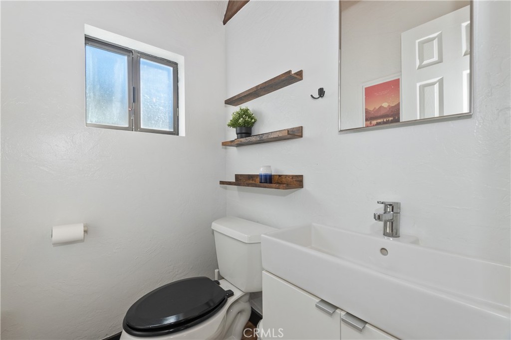 42533 Moonridge Road Big Bear Lake, CA 92315 - Photo 12 of 37 a bathroom with a toilet a sink and a shower