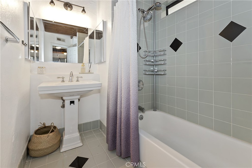 42533 Moonridge Road Big Bear Lake, CA 92315 - Photo 17 of 37 a bathroom with a sink a toilet and shower