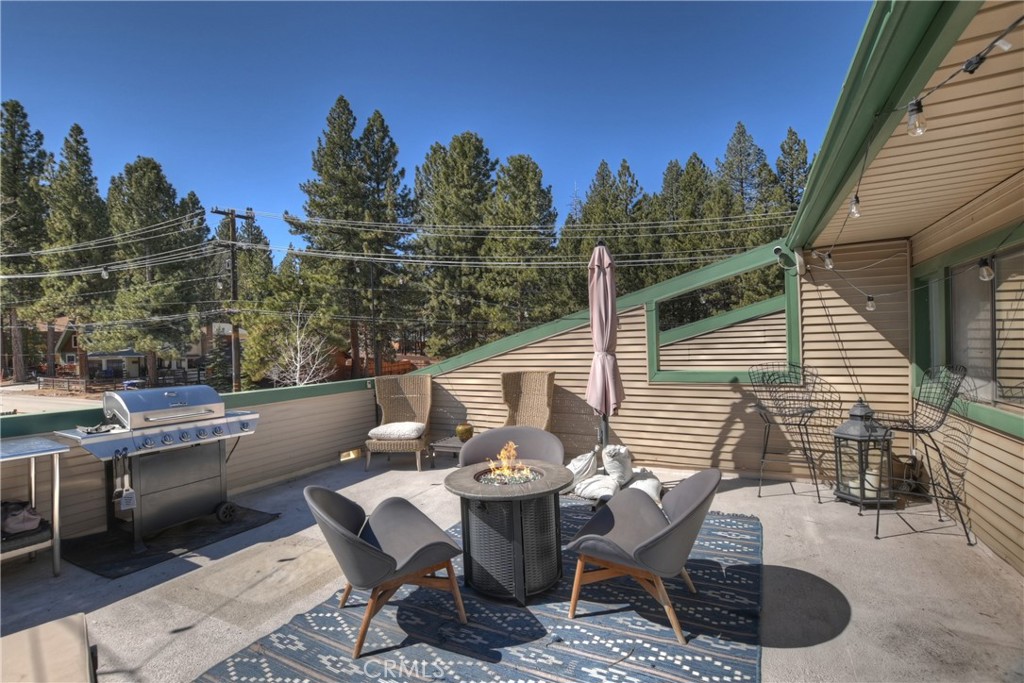 42533 Moonridge Road Big Bear Lake, CA 92315 - Photo 26 of 37 a view of a patio with iron fence