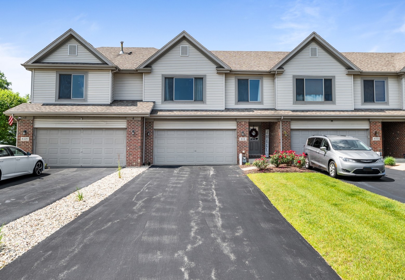8331 Chestnut Court Frankfort, IL 60423 - Photo 1 of 15 a front view of a house with a yard and garage