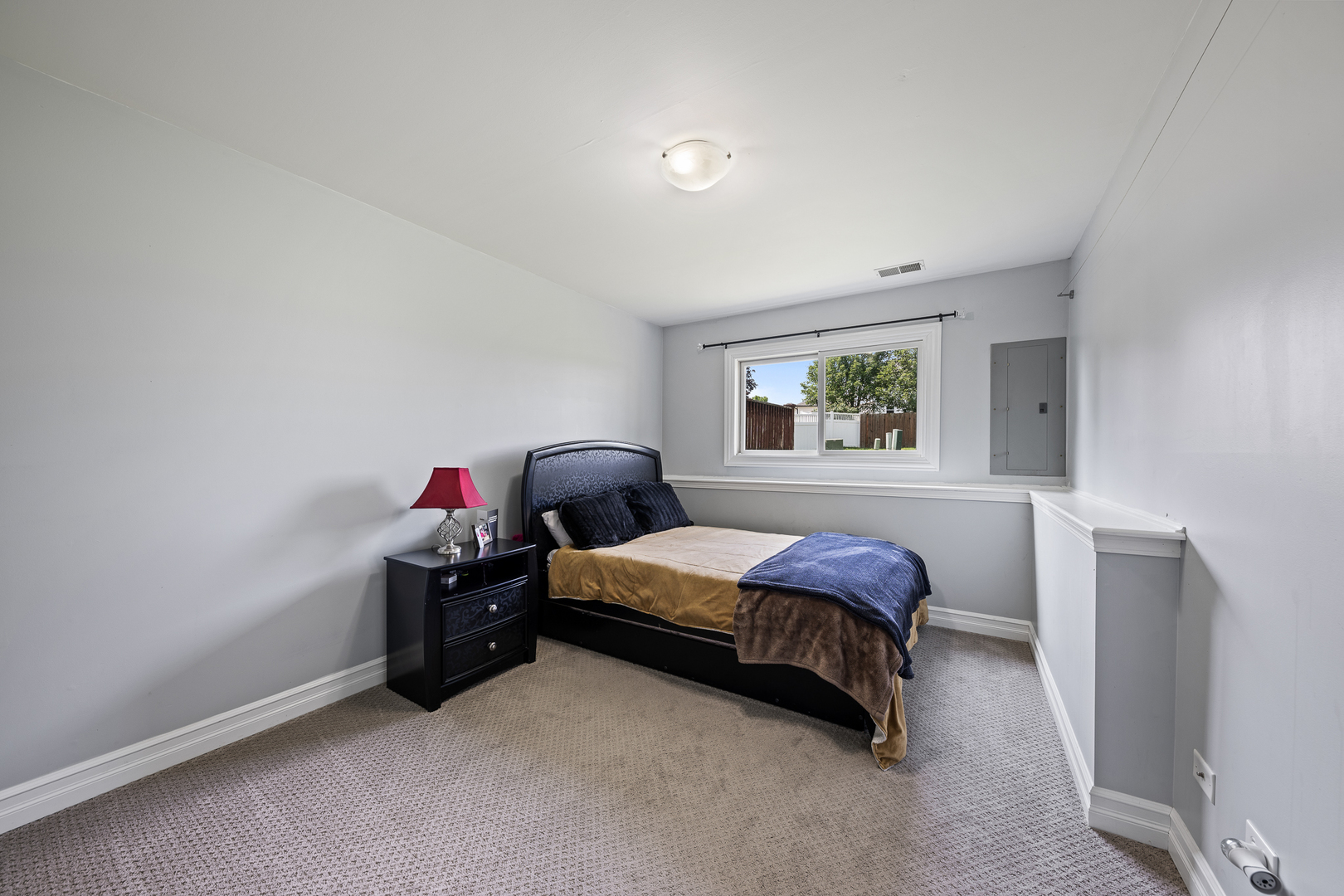 8331 Chestnut Court Frankfort, IL 60423 - Photo 12 of 15 a bedroom with a bed and a window