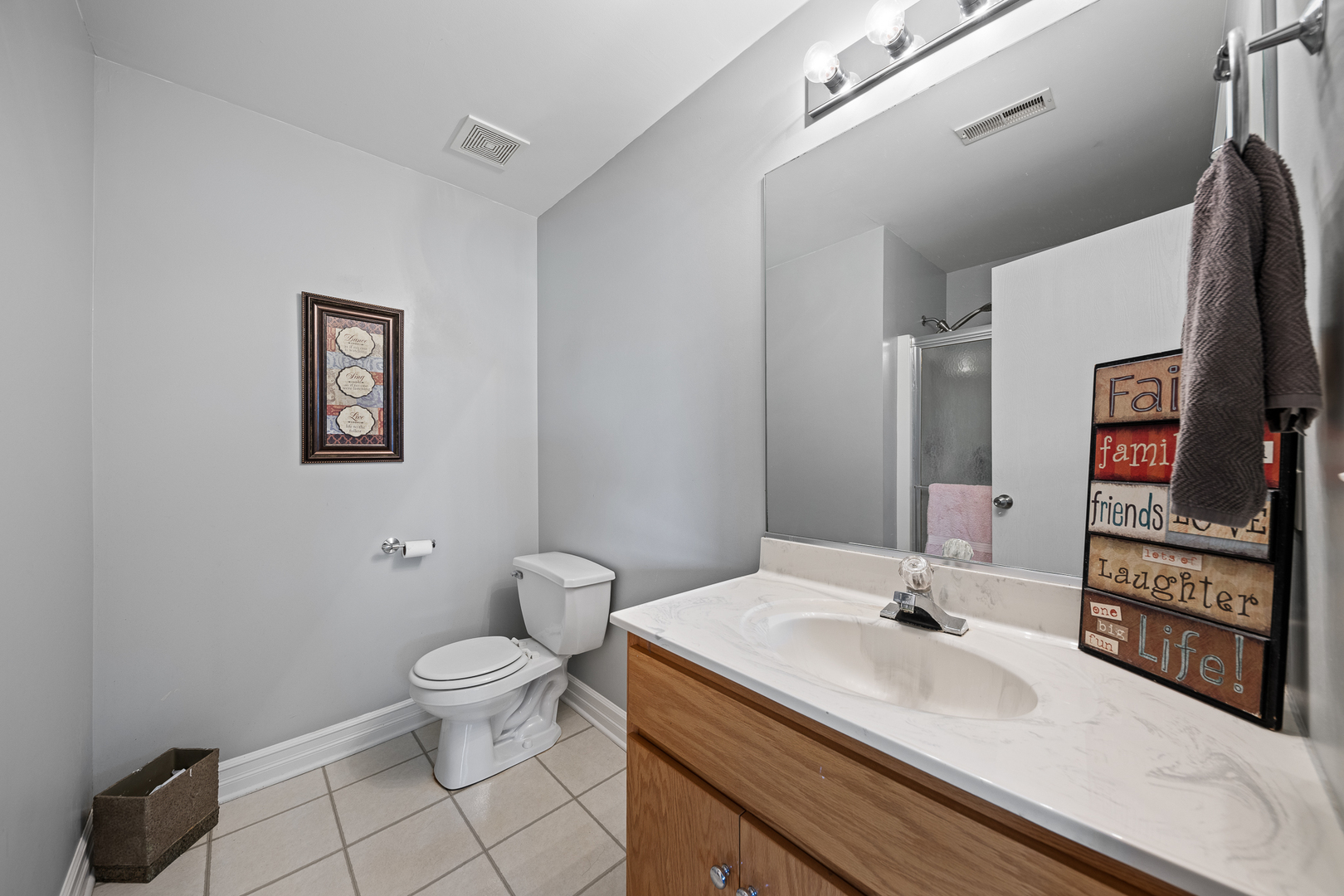 8331 Chestnut Court Frankfort, IL 60423 - Photo 13 of 15 a bathroom with a sink toilet and mirror