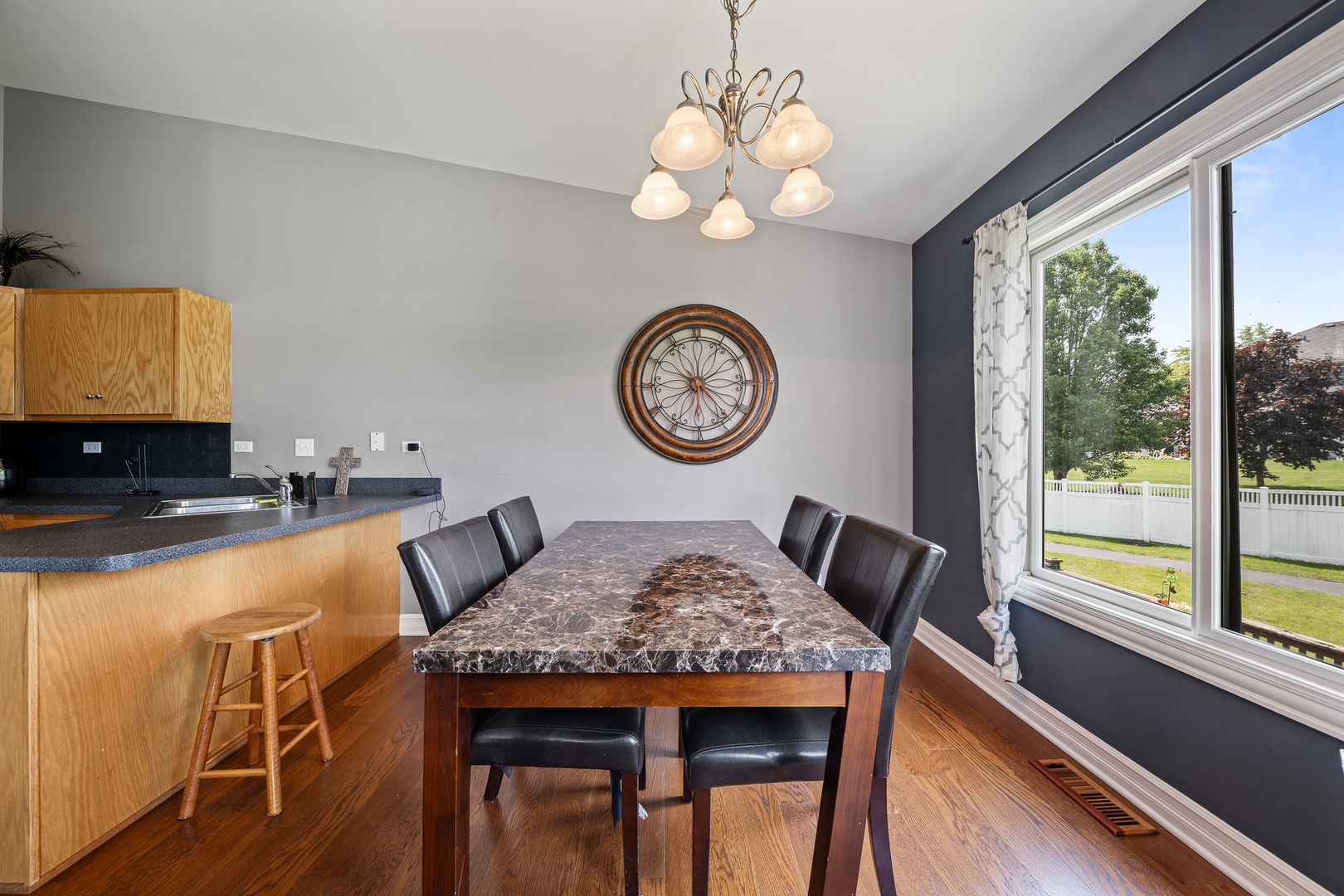 8331 Chestnut Court Frankfort, IL 60423 - Photo 5 of 15 a view of a dining area with furniture and a large window