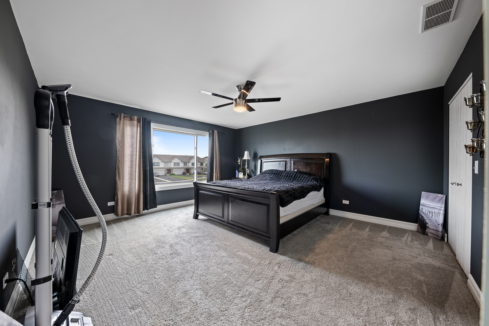 8331 Chestnut Court Frankfort, IL 60423 - Photo 7 of 15 a spacious bedroom with a bed and a ceiling fan