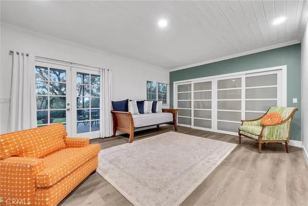 a bedroom with a bed and a couch