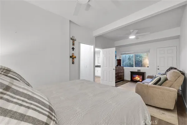 a bedroom with furniture and a fireplace