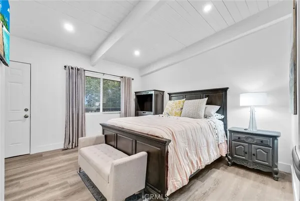 a bedroom with a bed and a couch