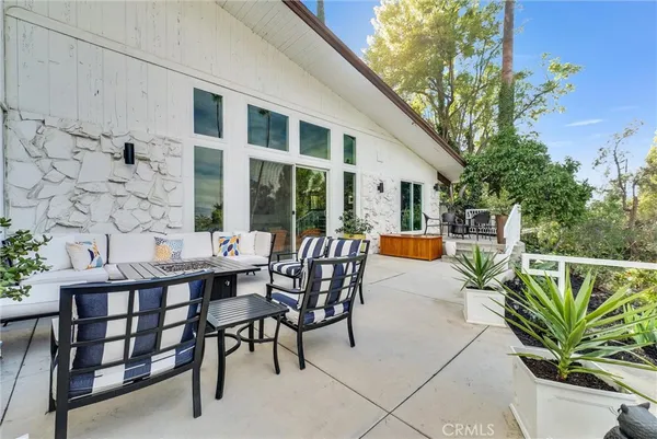 a view of a swimming pool with chairs