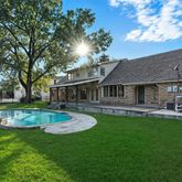 a view of house with a garden