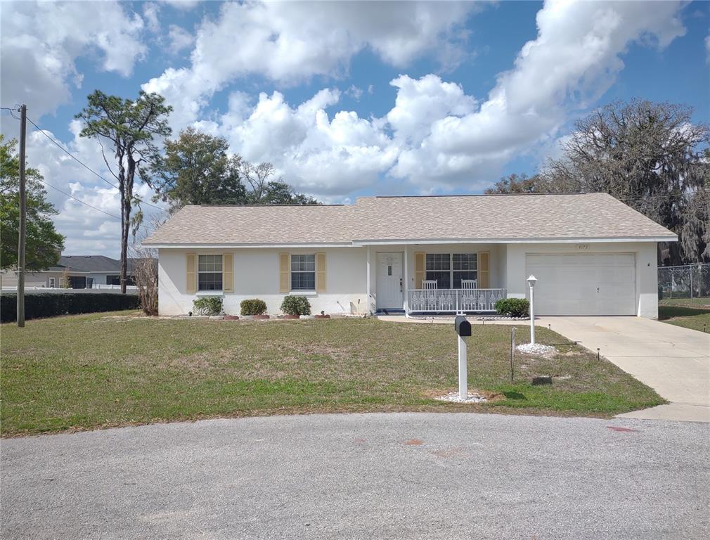4172 Northeast 35th Avenue Road Ocala, FL 34479 - Photo 1 of 1 a front view of a house with a garden and yard