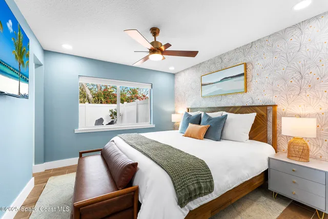 a bedroom with bed and window