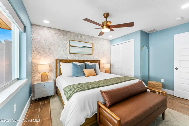 a bedroom with a bed and window