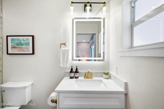 a bathroom with a sink and a toilet