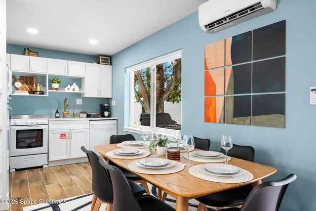 a kitchen with a table chairs stove and microwave