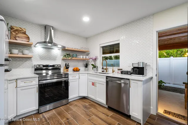a kitchen with a stove and a sink
