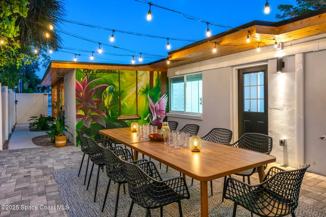 a table and chairs in front of a building