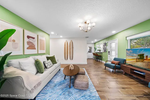 a living room with furniture fireplace and a table