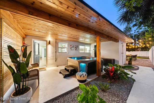 a view of a chairs and table in backyard