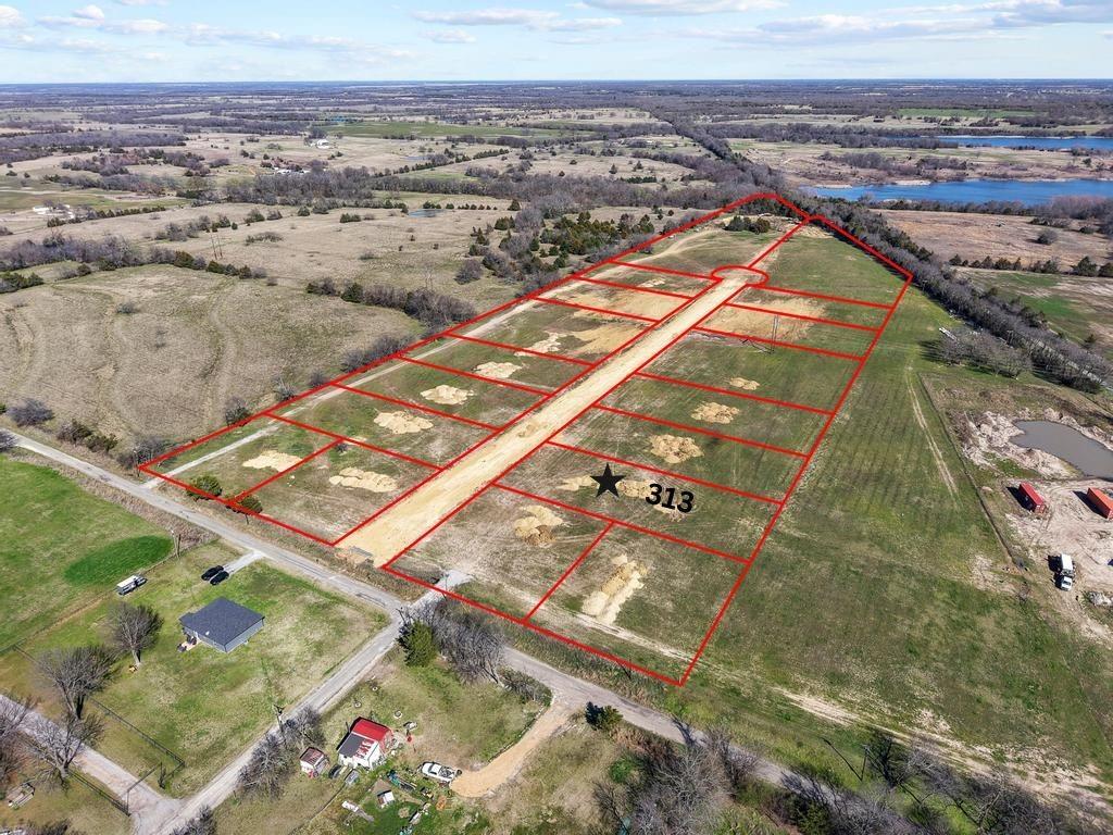 313 Roundtree Circle Wolfe City, TX 75496 - Photo 1 of 10 an aerial view of a city