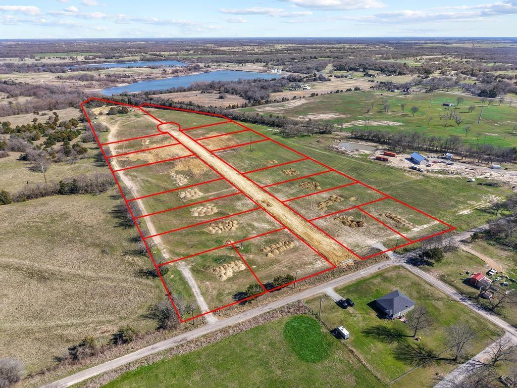 313 Roundtree Circle Wolfe City, TX 75496 - Photo 6 of 10 an aerial view of residential houses with outdoor space