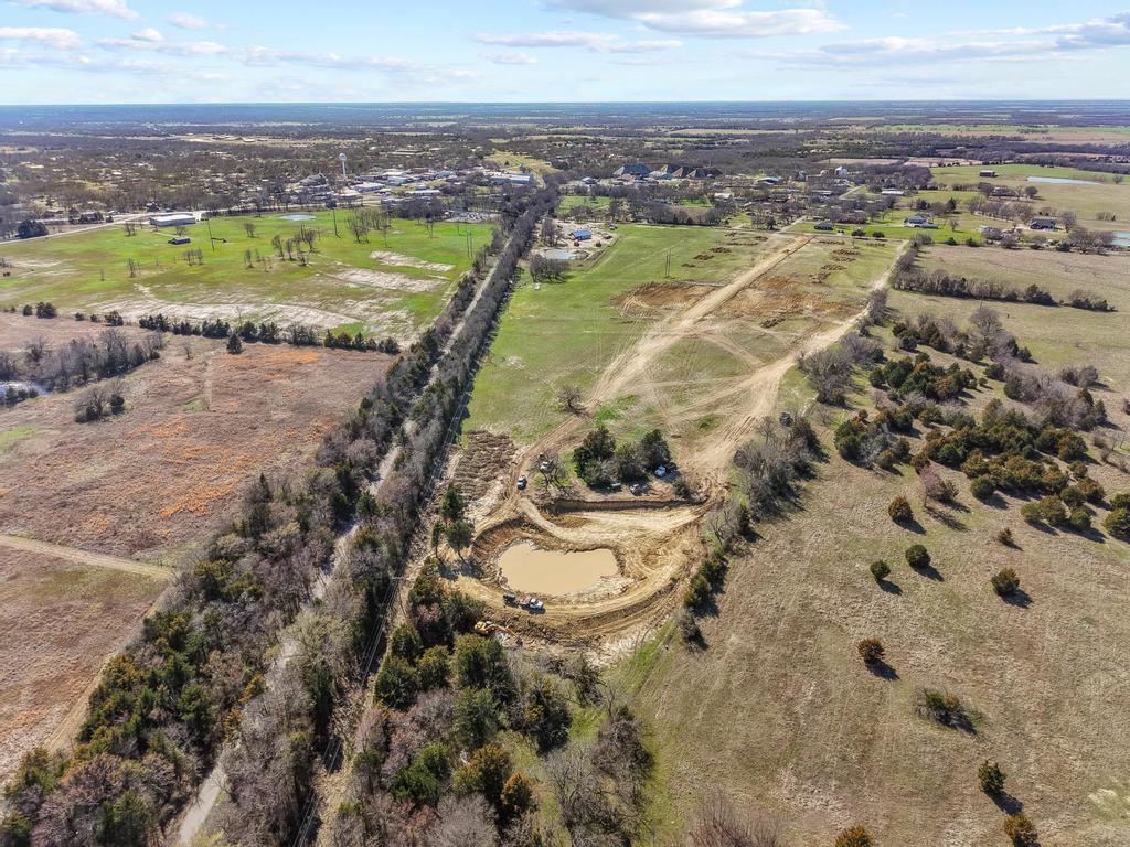 313 Roundtree Circle Wolfe City, TX 75496 - Photo 8 of 10 a view of a city with an ocean beach