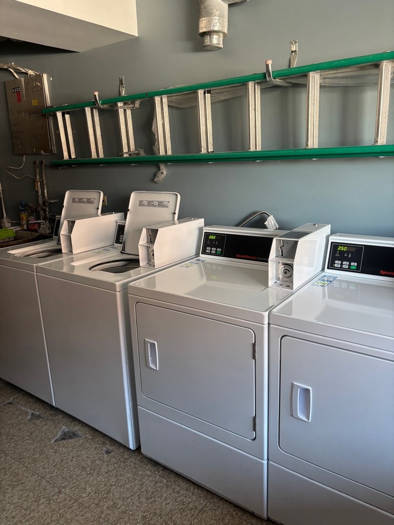6323 West 64th Place, Unit 1D Chicago, IL 60638 - Photo 13 of 16 a utility room with dryer and washer