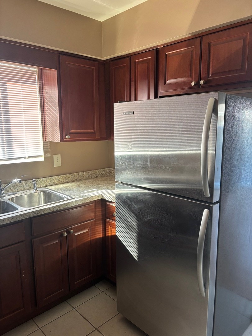 6323 West 64th Place, Unit 1D Chicago, IL 60638 - Photo 6 of 16 a kitchen with a sink and an oven