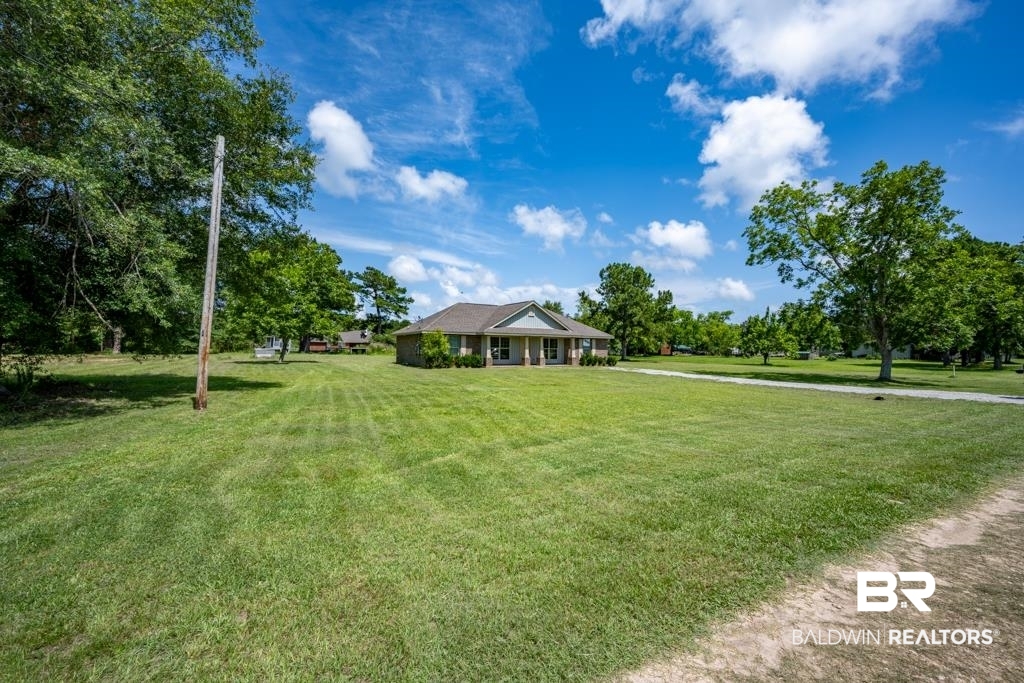 15874 Carver Road, Unit C Foley, AL 36535 - Photo 3 of 18 View of front facade with a front yard