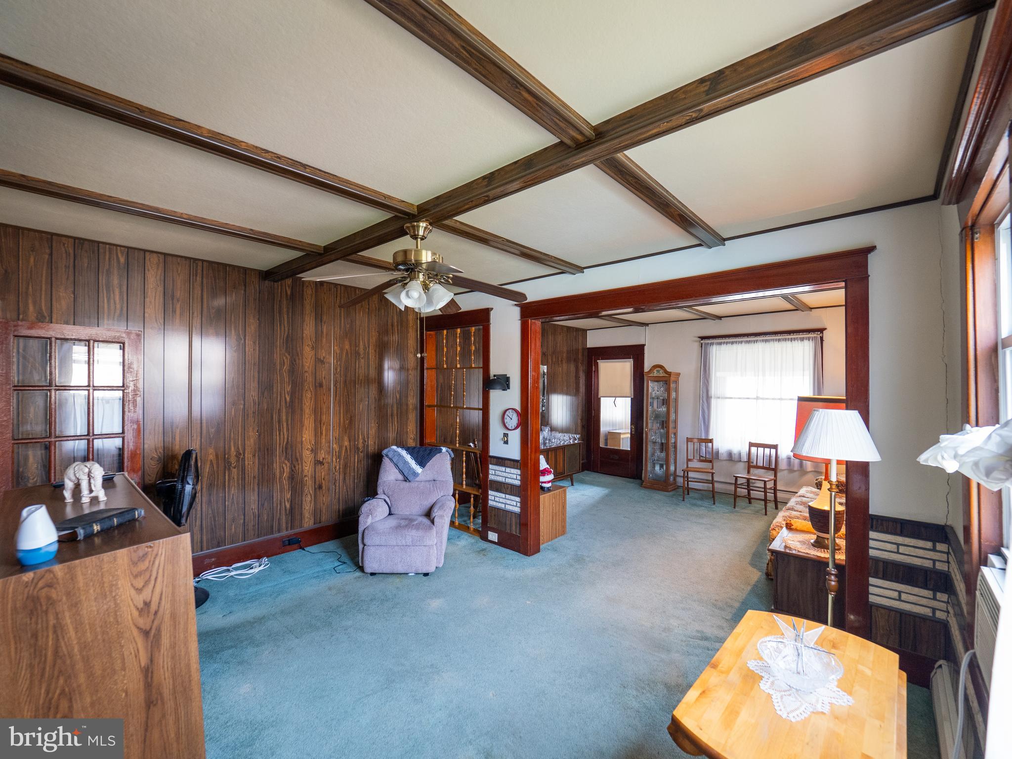 1615 Butler Street Easton, PA 18042 - Photo 17 of 38 a living room with furniture and a chandelier
