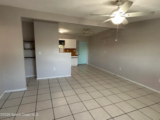 a view of a kitchen with a sink and cabinets