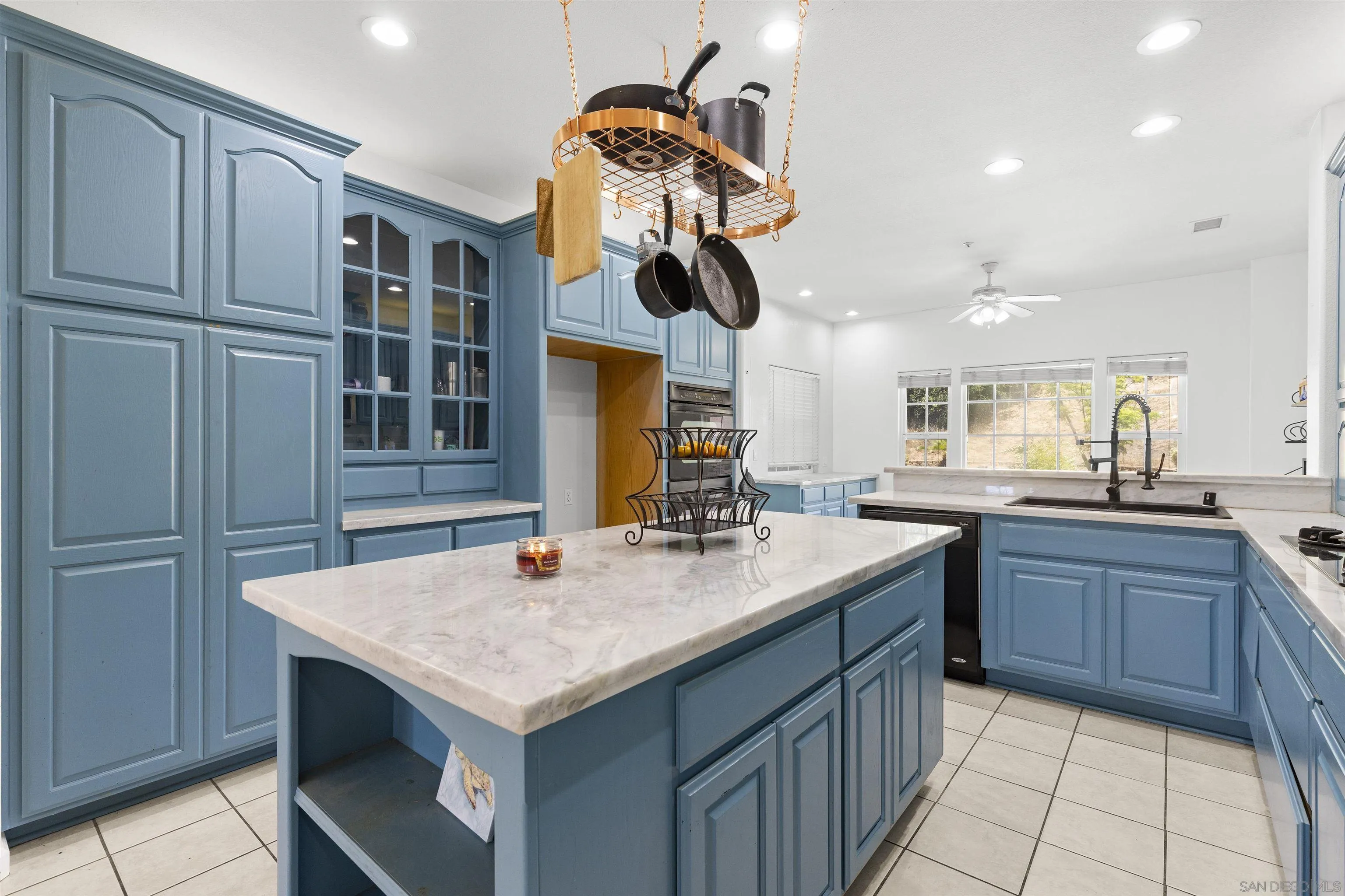 24849 Pappas Road Ramona, CA 92065 - Photo 11 of 50 a kitchen with kitchen island granite countertop a stove and a sink