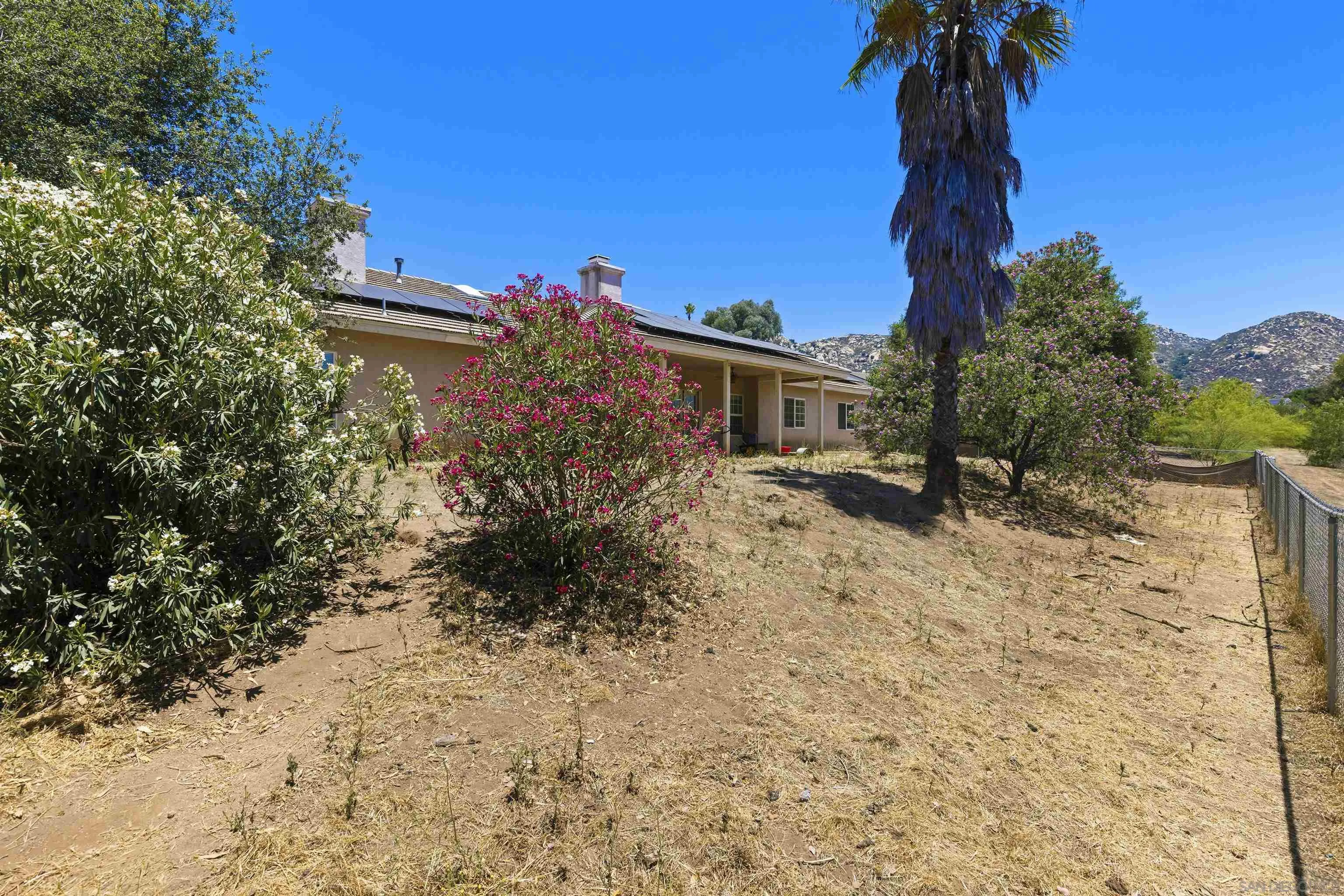 24849 Pappas Road Ramona, CA 92065 - Photo 33 of 50 a view of a house with a yard