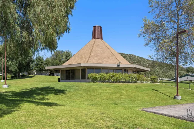 a view of a park with swings and slides