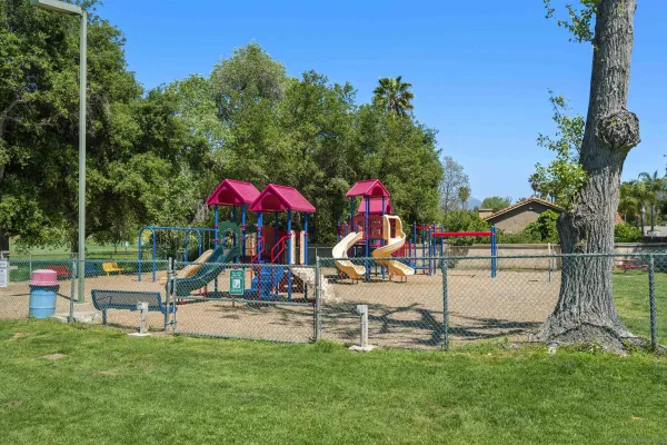 a view of a park with swings