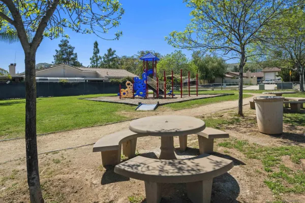 a view of a field with an ocean