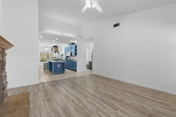 a view of kitchen with cabinets and wooden floor