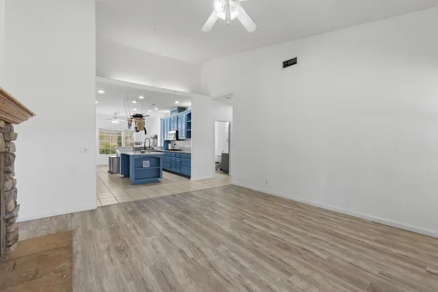 a view of kitchen with cabinets and wooden floor