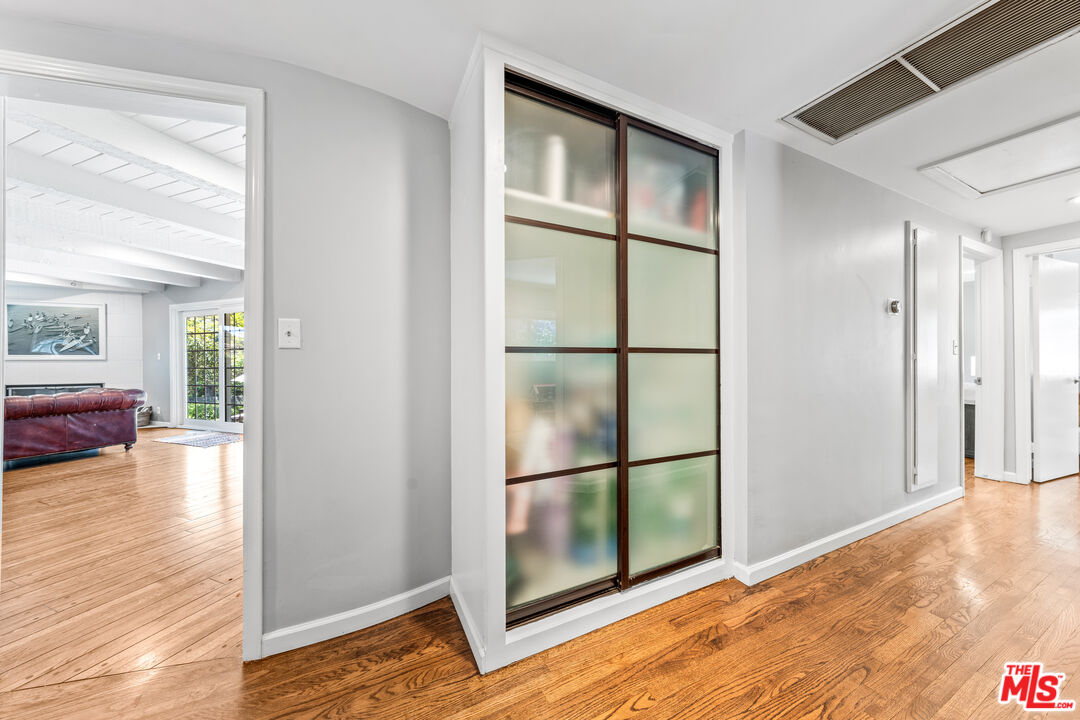3940 Mandeville Canyon Road Los Angeles, CA 90049 - Photo 28 of 54 a view of livingroom with furniture wooden floor and window
