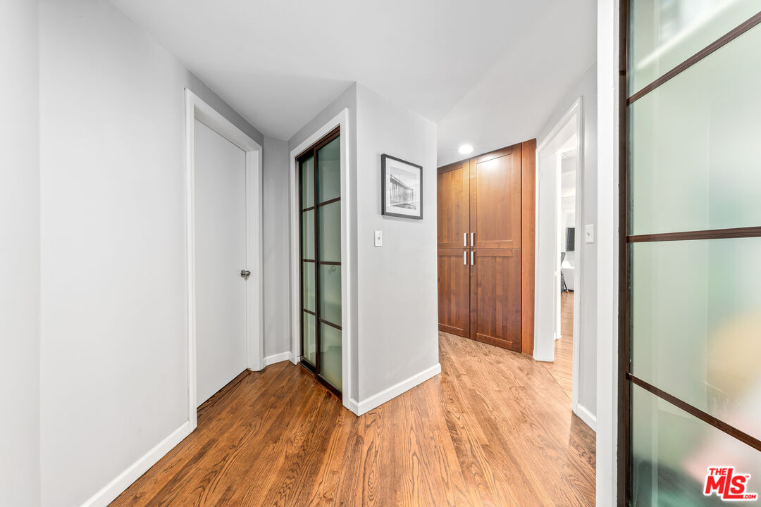 3940 Mandeville Canyon Road Los Angeles, CA 90049 - Photo 29 of 54 a view of empty room with wooden floor
