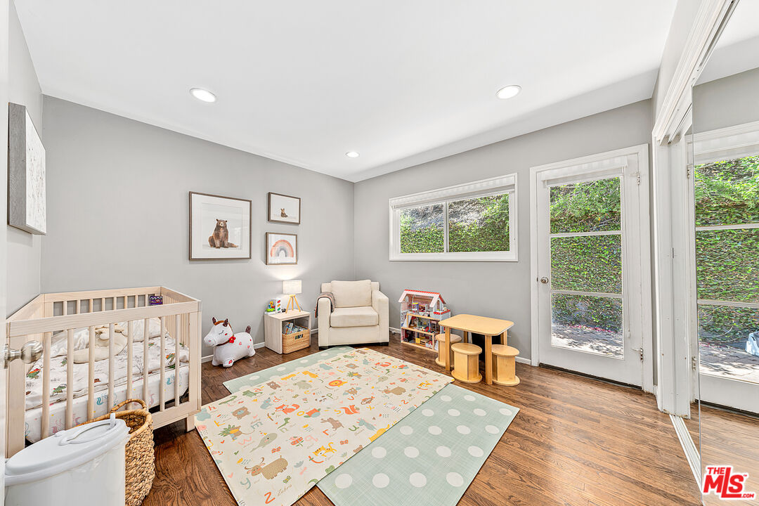 3940 Mandeville Canyon Road Los Angeles, CA 90049 - Photo 30 of 54 a bed room with a bed and a couch