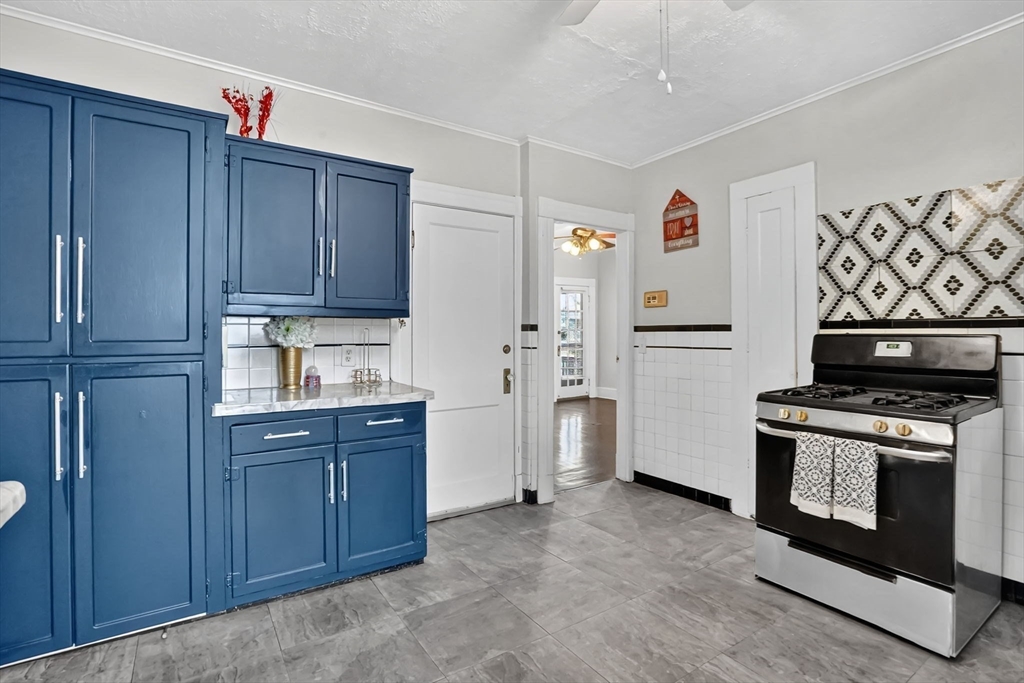 55 Florida Street Springfield, MA 01109 - Photo 16 of 42 a kitchen with stainless steel appliances a stove and a refrigerator