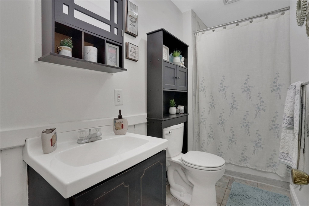 55 Florida Street Springfield, MA 01109 - Photo 28 of 42 a bathroom with a sink toilet and shower