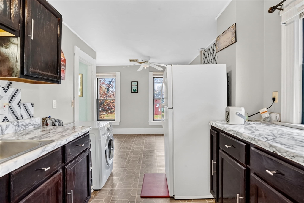 55 Florida Street Springfield, MA 01109 - Photo 30 of 42 a kitchen with a refrigerator and a sink