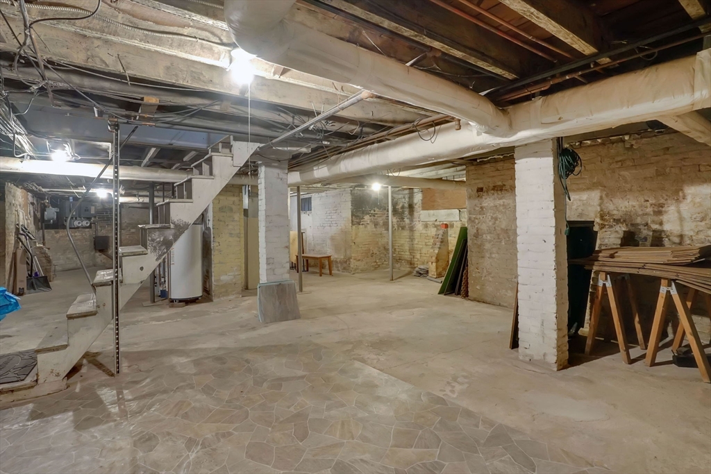 55 Florida Street Springfield, MA 01109 - Photo 33 of 42 a view of empty room with wooden walls